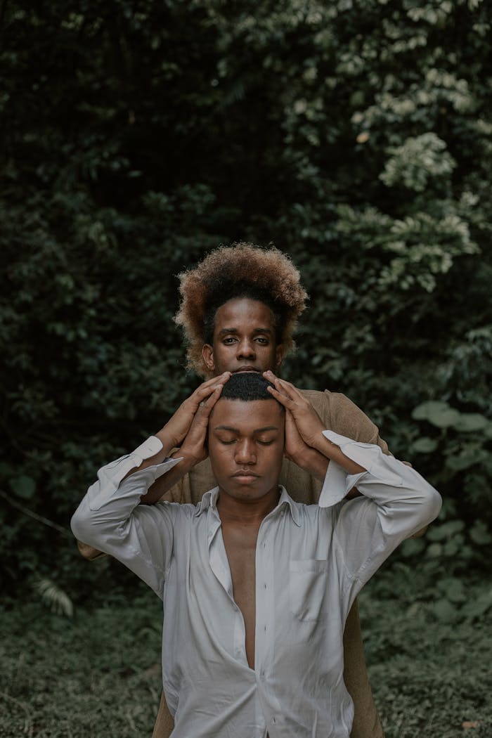 Man Holding Man's Head